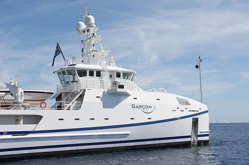 a large white boat in the water aboard GARCON Yacht for Sale