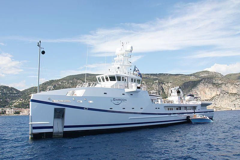 a large white boat in the water aboard GARCON Yacht for Sale