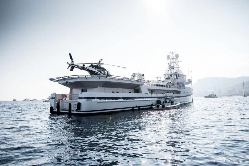 a large white boat in the water aboard GARCON Yacht for Sale