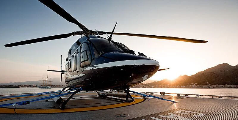 a helicopter on a runway aboard GARCON Yacht for Sale