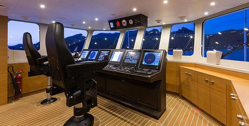 a room with computers and monitors aboard GARCON Yacht for Sale