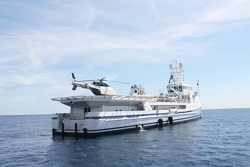 a white boat in the water aboard GARCON Yacht for Sale