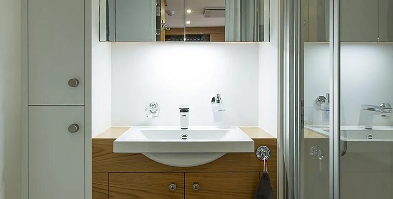 a bathroom sink with a mirror aboard GARCON Yacht for Sale