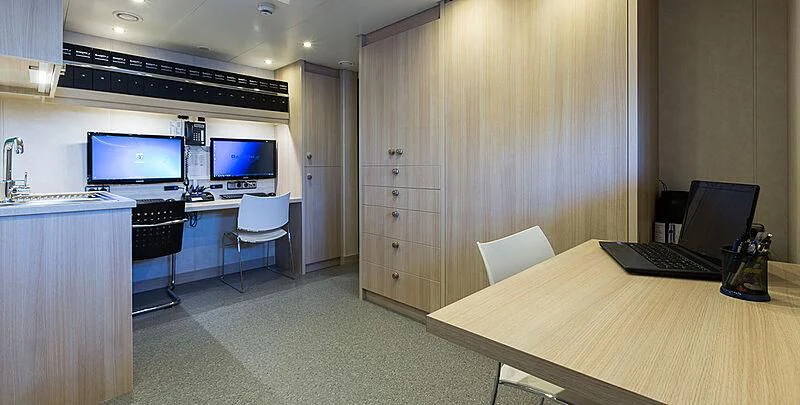 a room with a table and a computer aboard GARCON Yacht for Sale