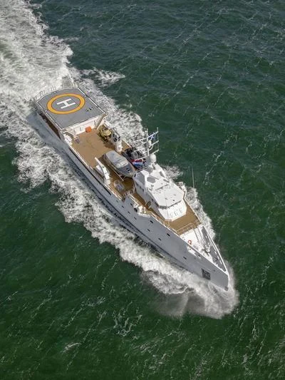 a large ship in the water aboard GARCON Yacht for Sale