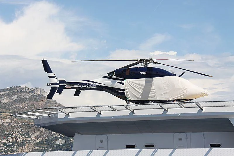 a helicopter on a roof aboard GARCON Yacht for Sale