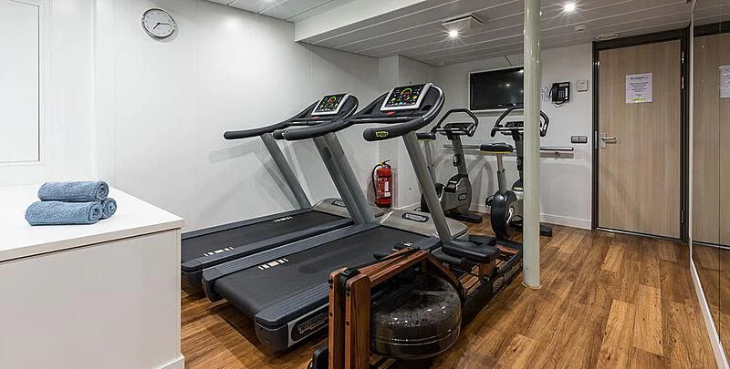a gym with equipment aboard GARCON Yacht for Sale