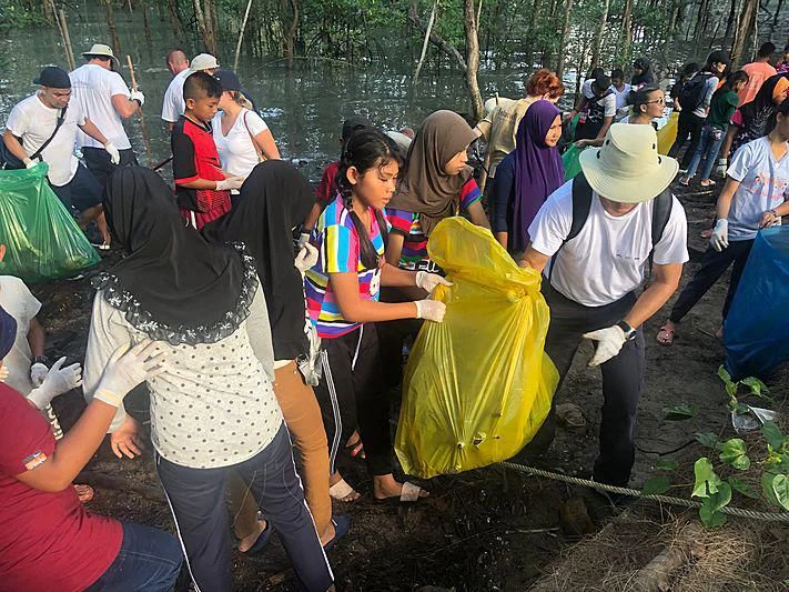 a group of people holding bags aboard GARCON Yacht for Sale