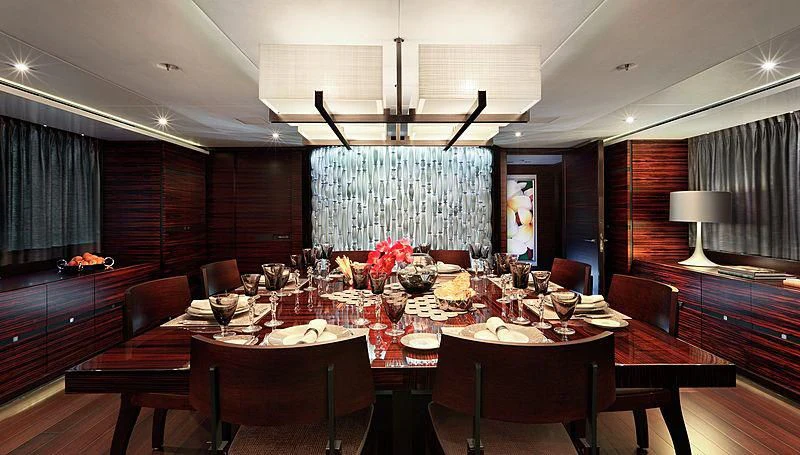 a dining room with a table and chairs aboard R JUNIORS Yacht for Sale