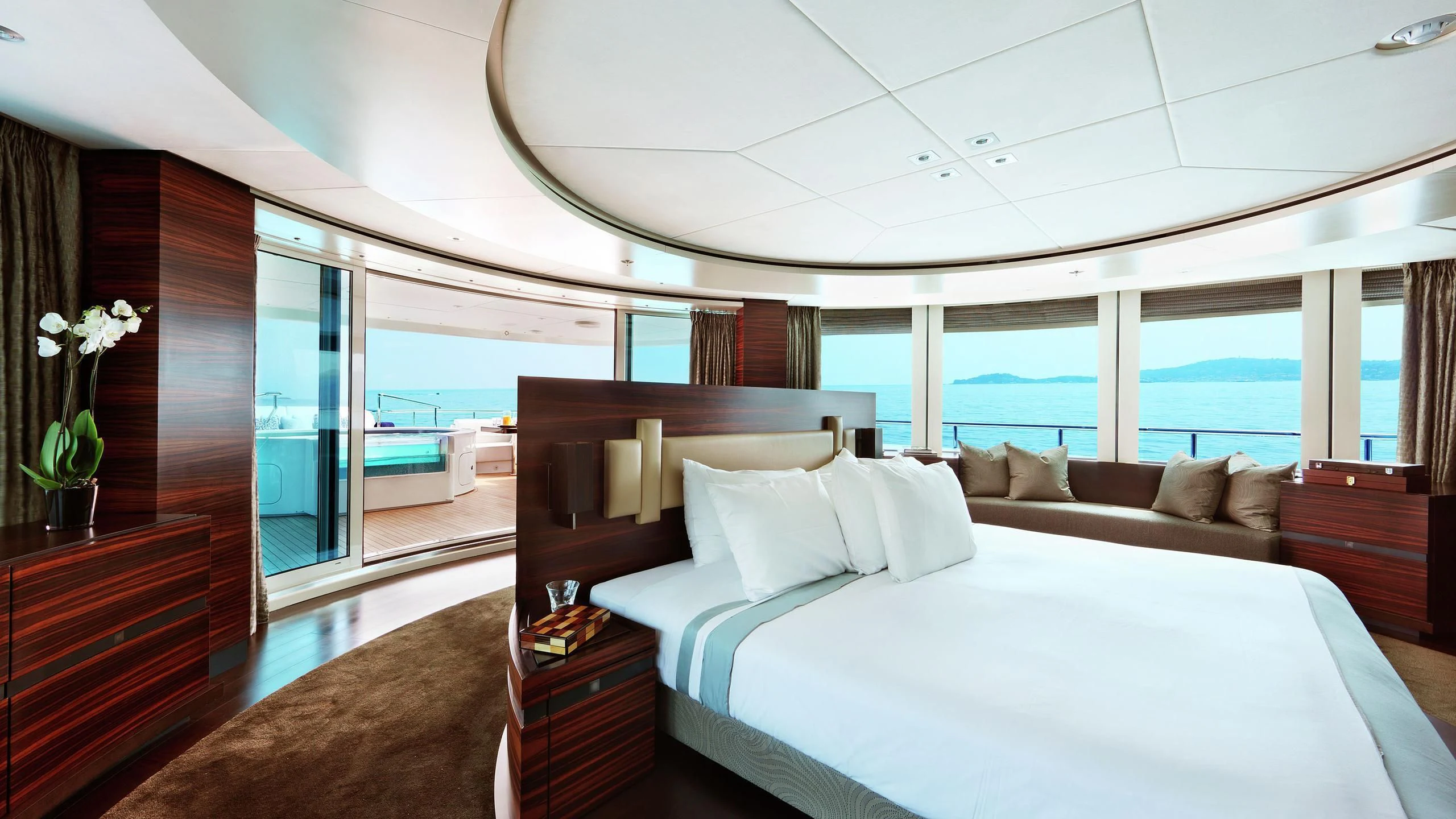 a large bed in a room aboard R JUNIORS Yacht for Sale