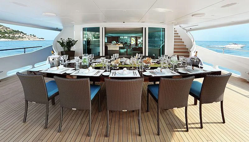 a table set for a dinner party aboard R JUNIORS Yacht for Sale