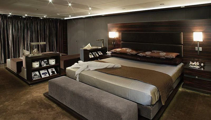 a large bedroom with a large bed aboard R JUNIORS Yacht for Sale
