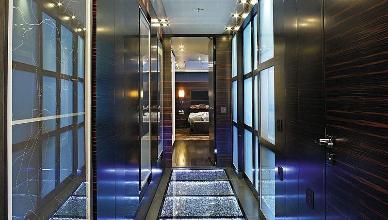 a hallway with glass doors aboard R JUNIORS Yacht for Sale