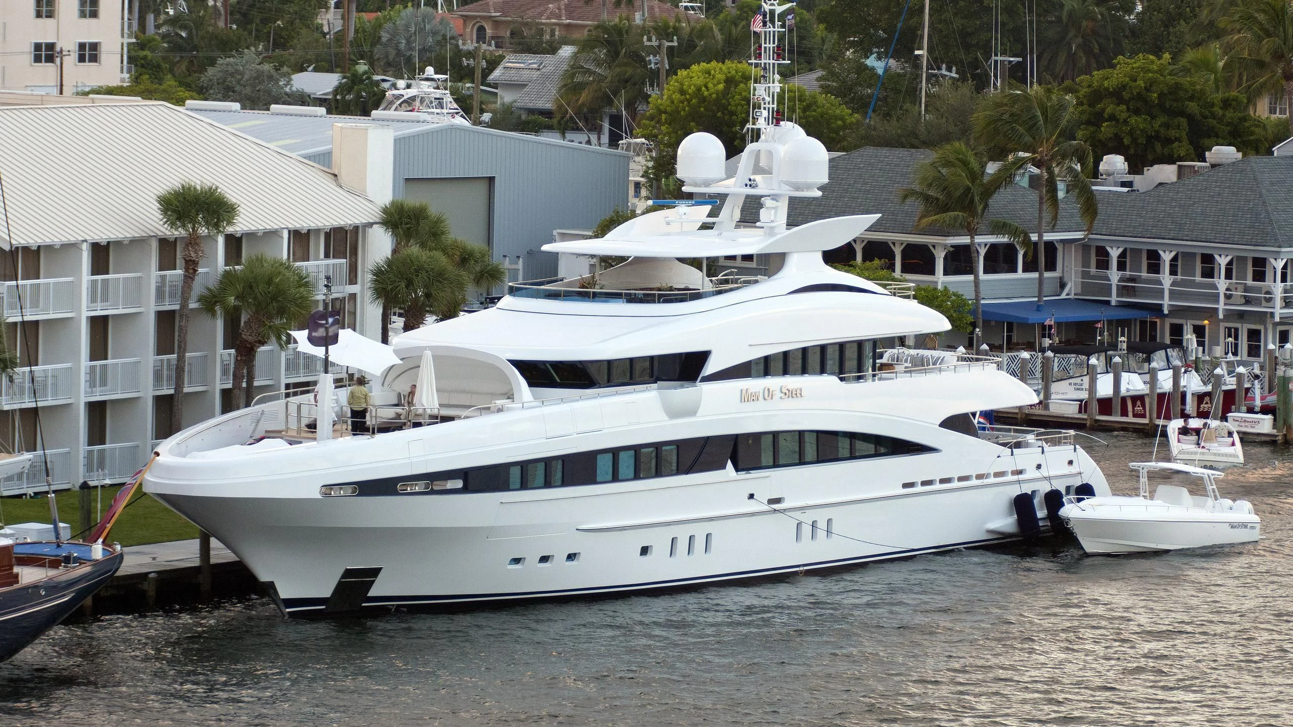 a large white boat in a harbor aboard R JUNIORS Yacht for Sale