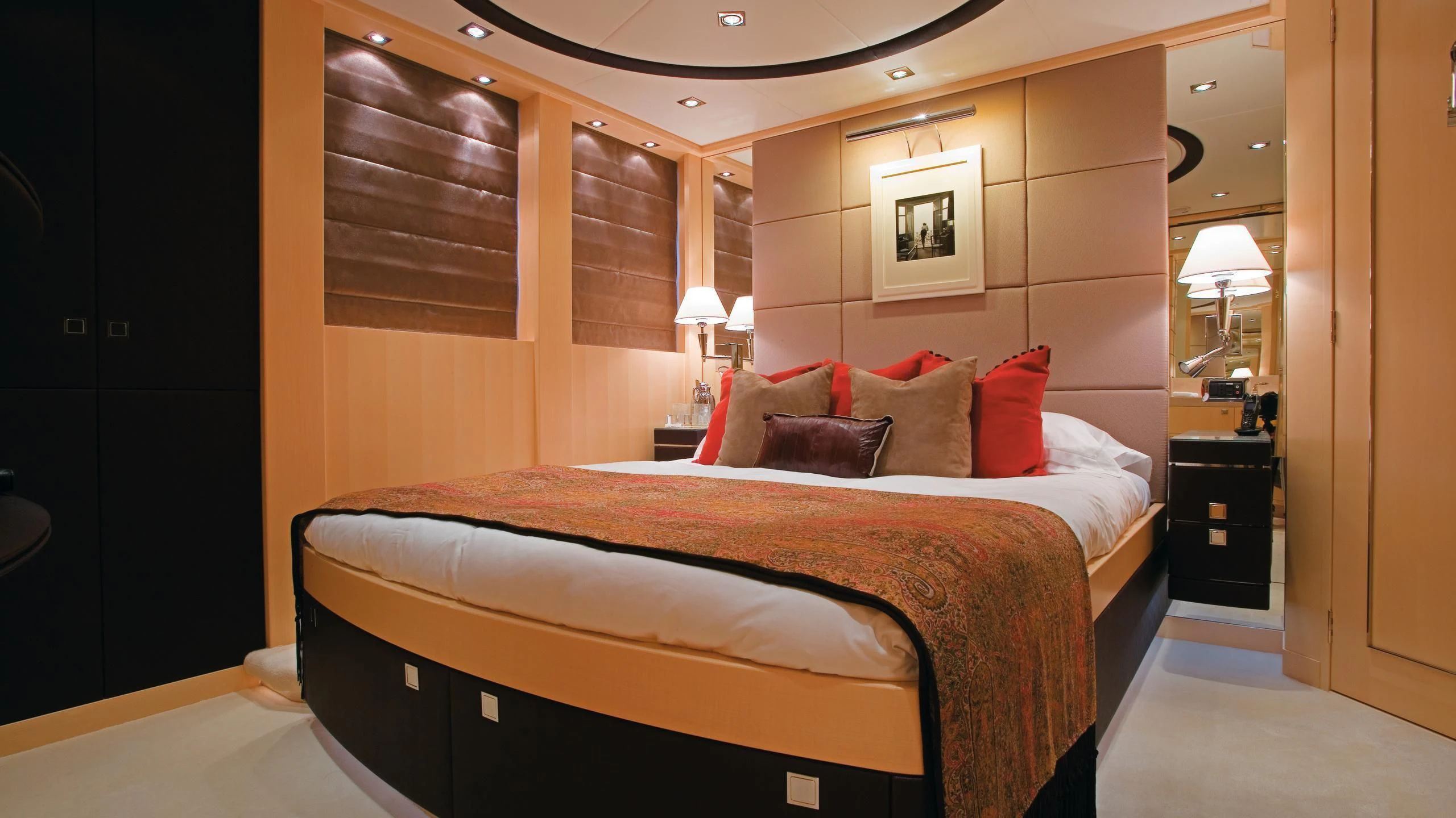 a bed with pillows on it aboard G-FORCE Yacht for Sale