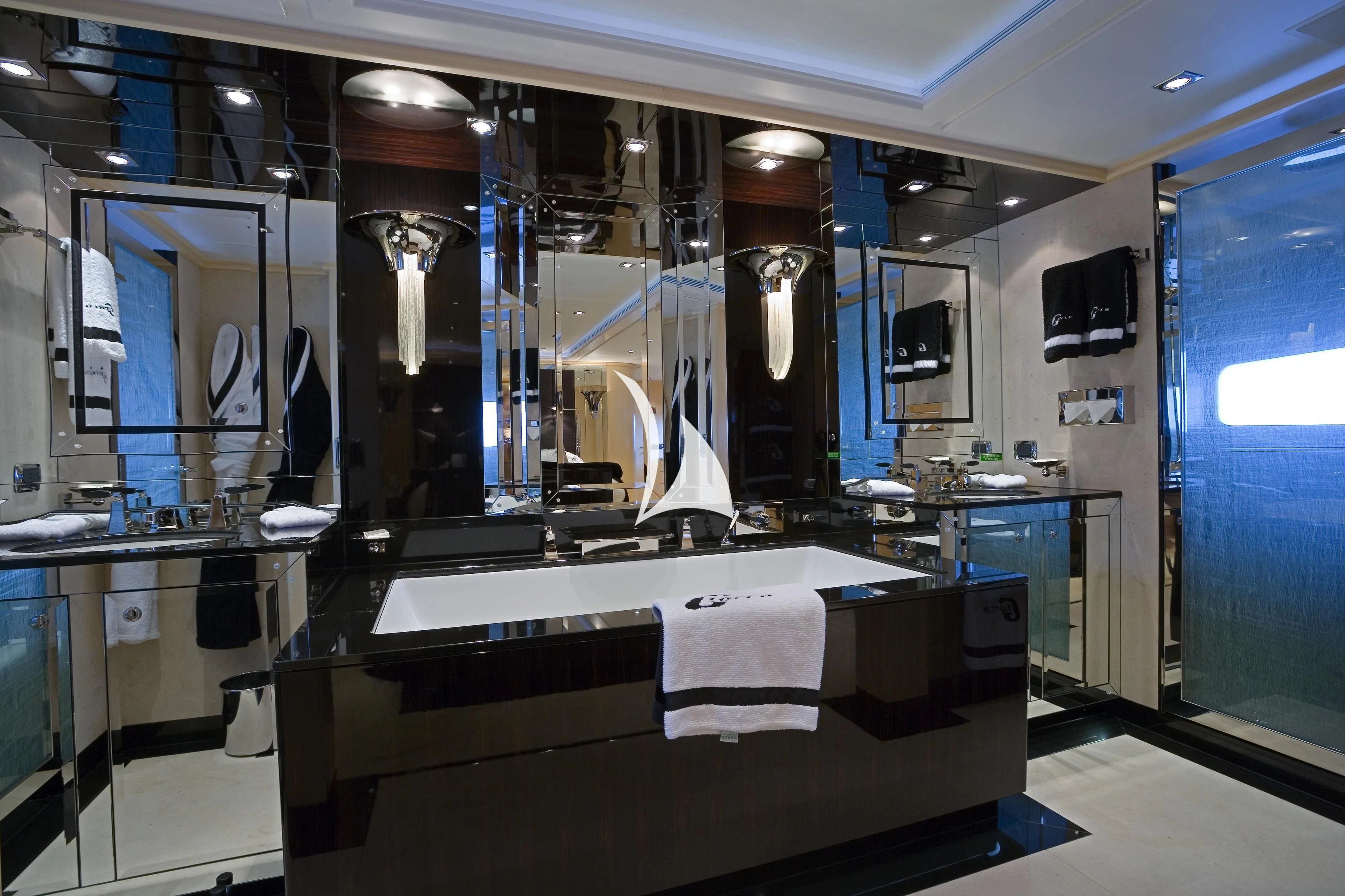 a bathroom with a countertop sink and cabinets aboard G-FORCE Yacht for Sale