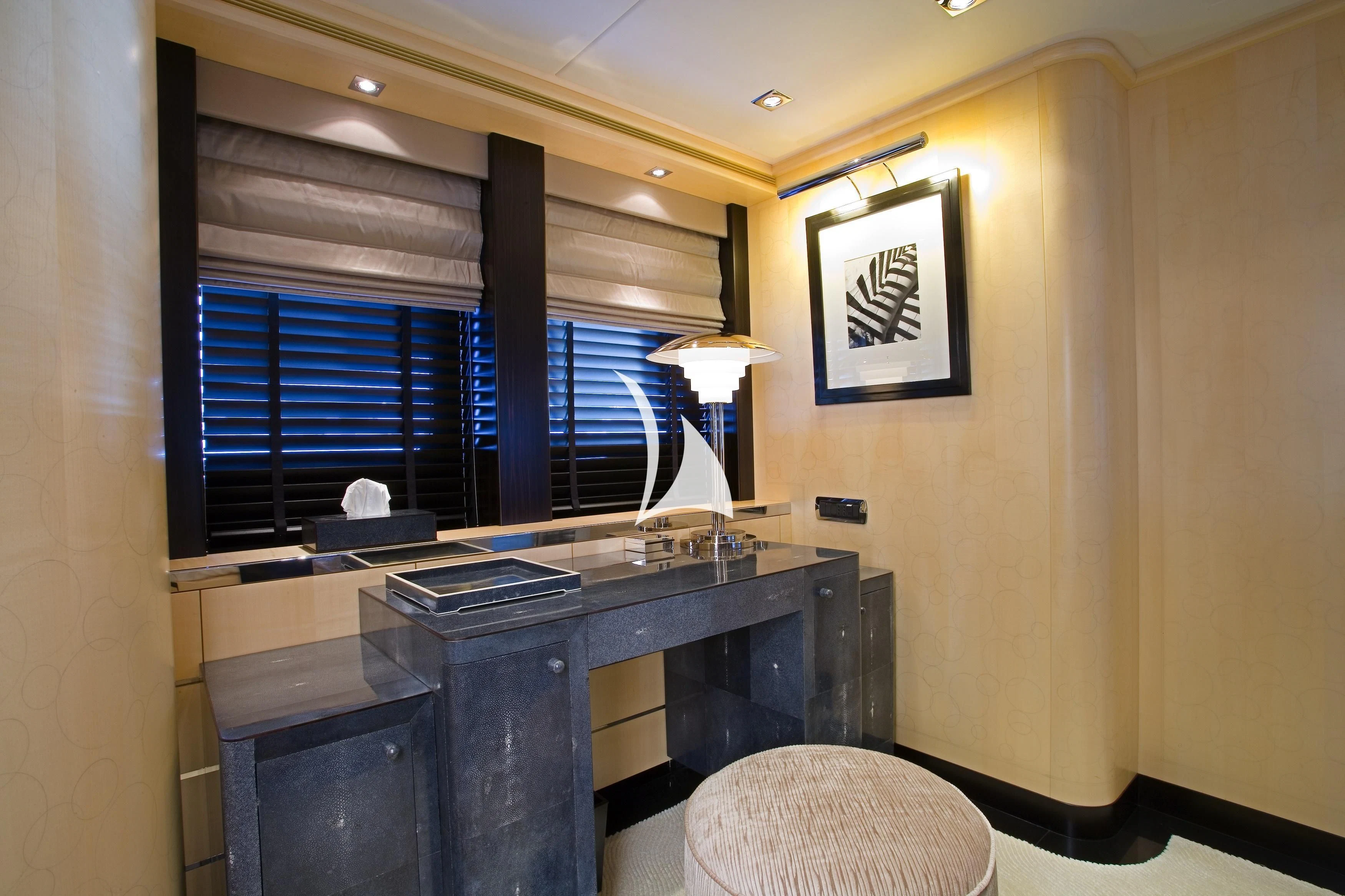 a room with a desk and a window aboard G-FORCE Yacht for Sale