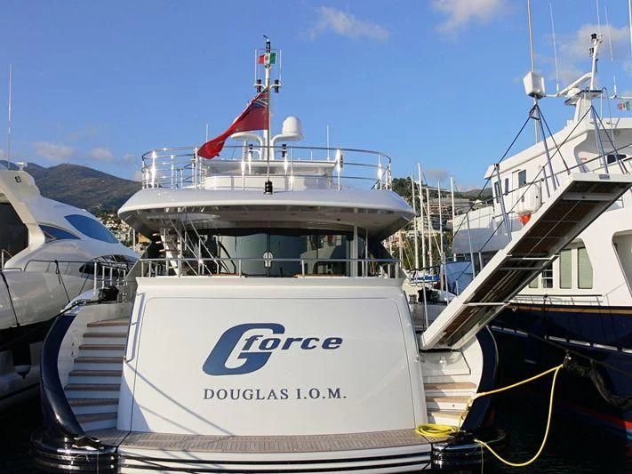 a boat with a flag on the front aboard G-FORCE Yacht for Sale
