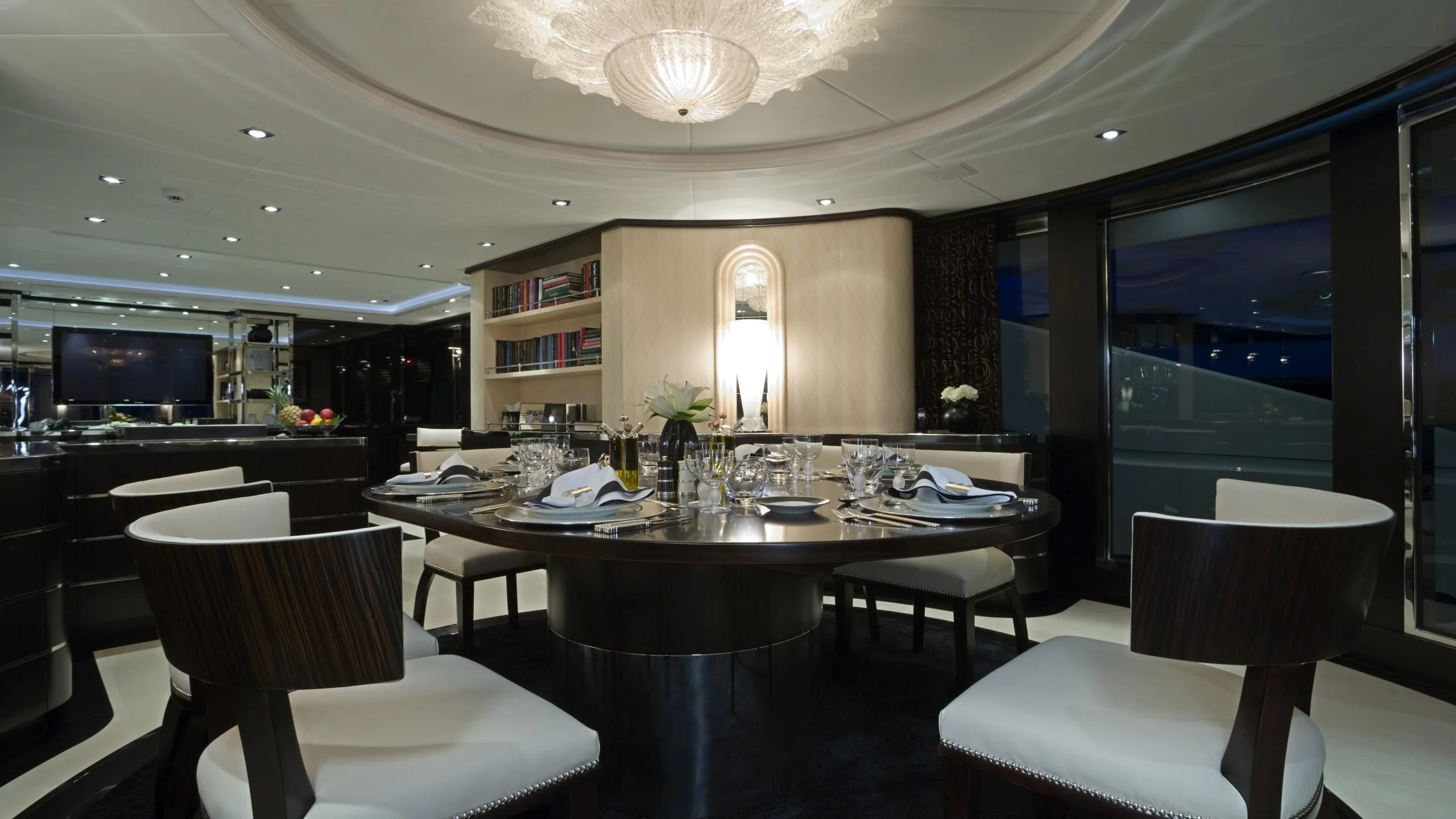 a large dining table in a room aboard G-FORCE Yacht for Sale