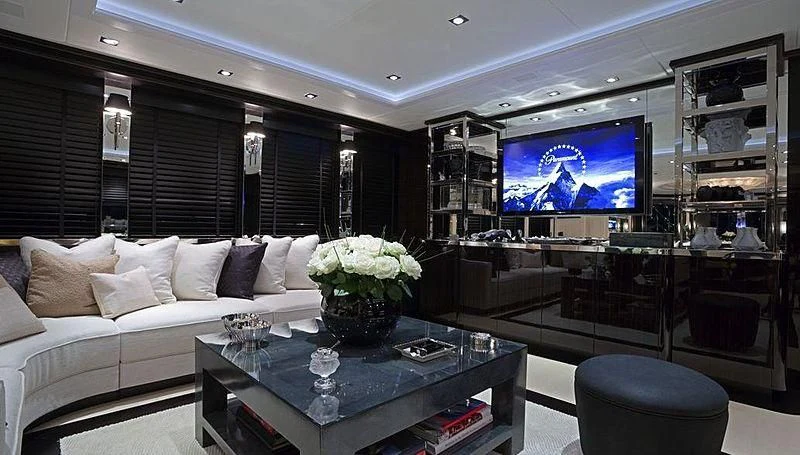 a living room with a large television aboard G-FORCE Yacht for Sale