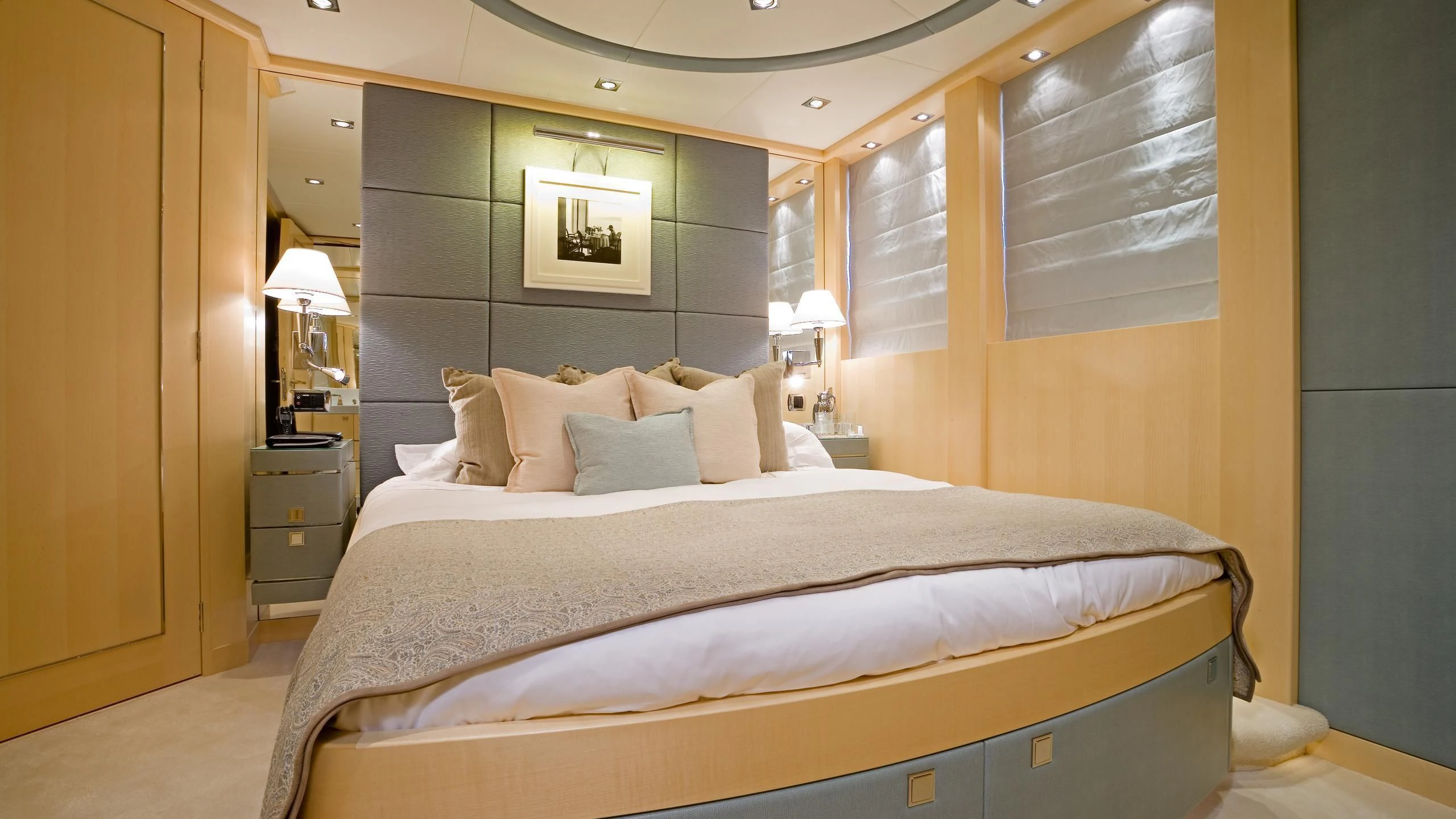a bed with a white comforter aboard G-FORCE Yacht for Sale