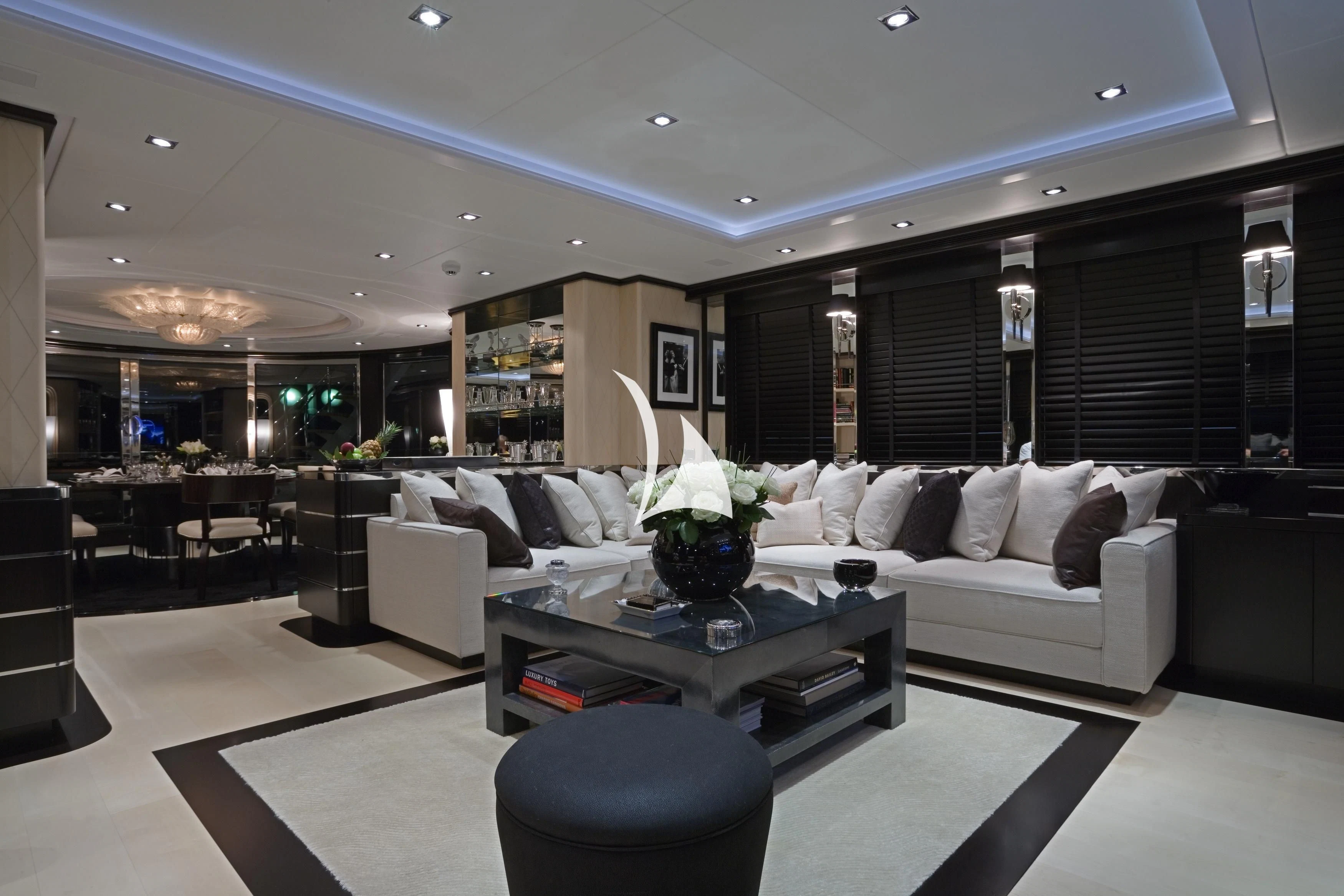 a living room with a couch and a coffee table aboard G-FORCE Yacht for Sale