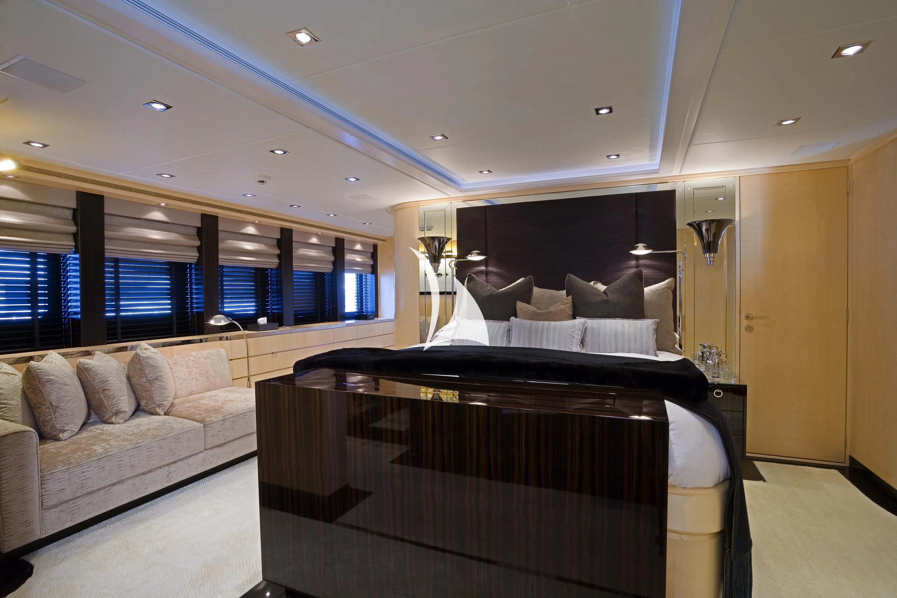 a living room with a large couch aboard G-FORCE Yacht for Sale