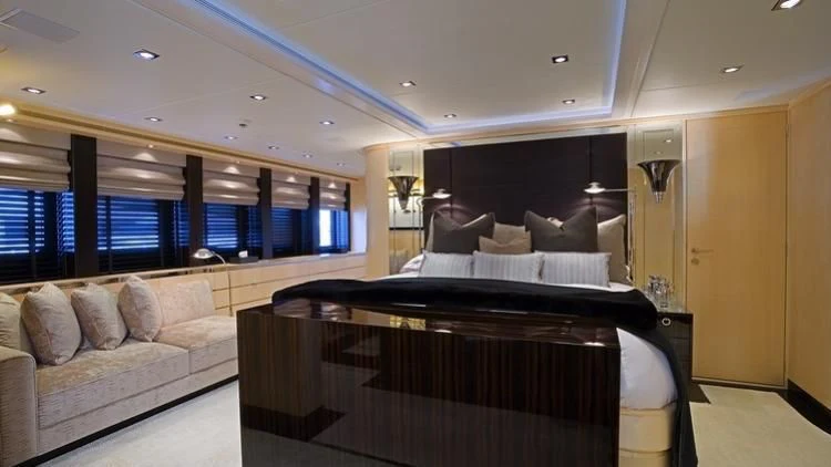 a large bedroom with a bed aboard G-FORCE Yacht for Sale
