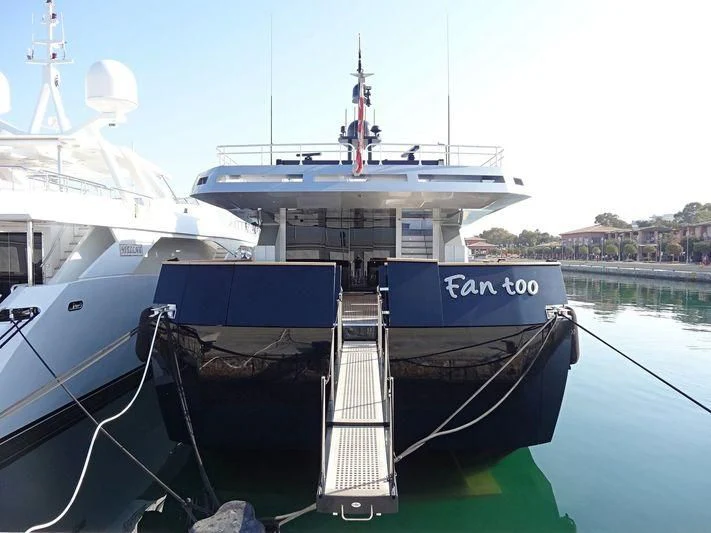 a boat docked at a pier aboard FAN TOO Yacht for Sale