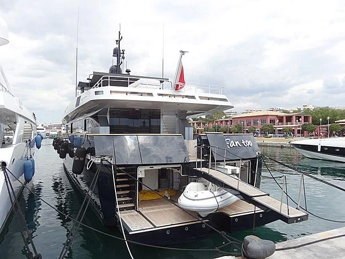a boat docked at a pier aboard FAN TOO Yacht for Sale
