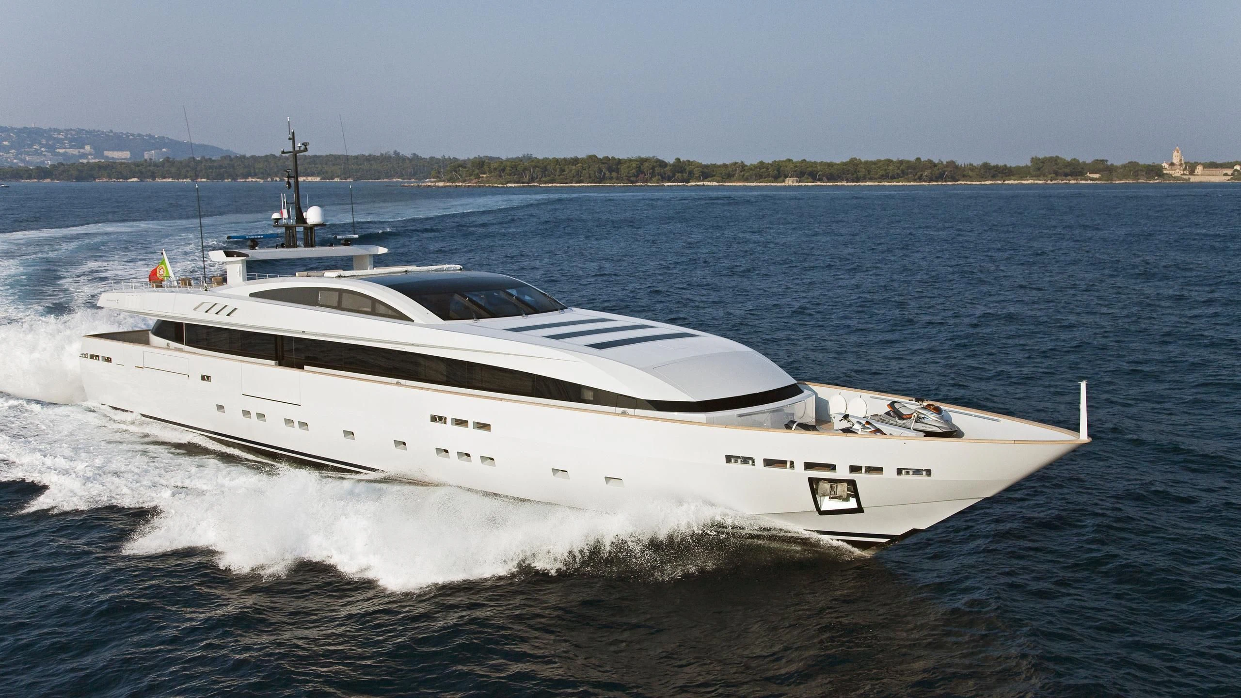 a white yacht on the water aboard FAN TOO Yacht for Sale