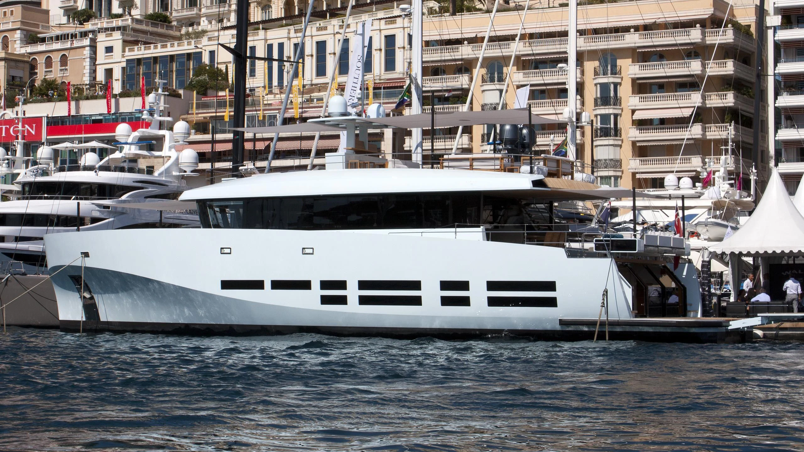 a boat docked in a harbor aboard KANGA Yacht for Sale