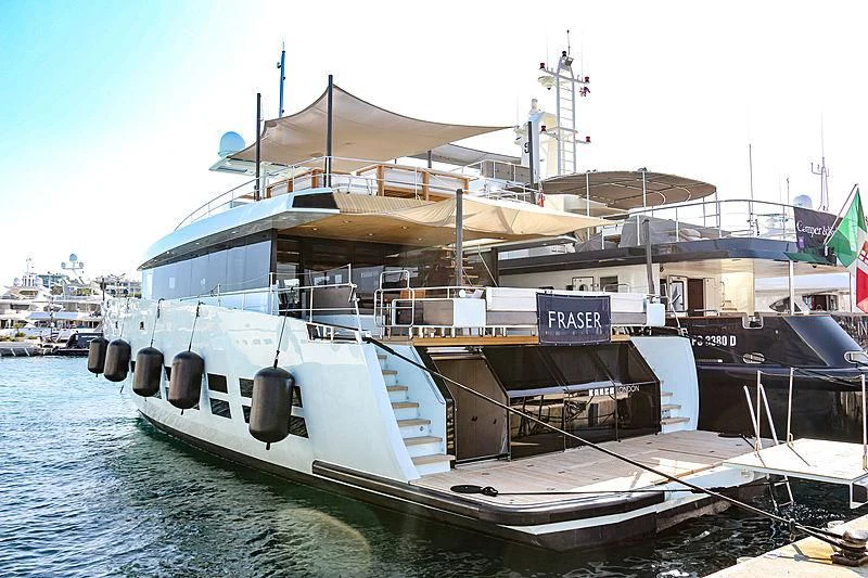 a large boat docked at a pier aboard KANGA Yacht for Sale