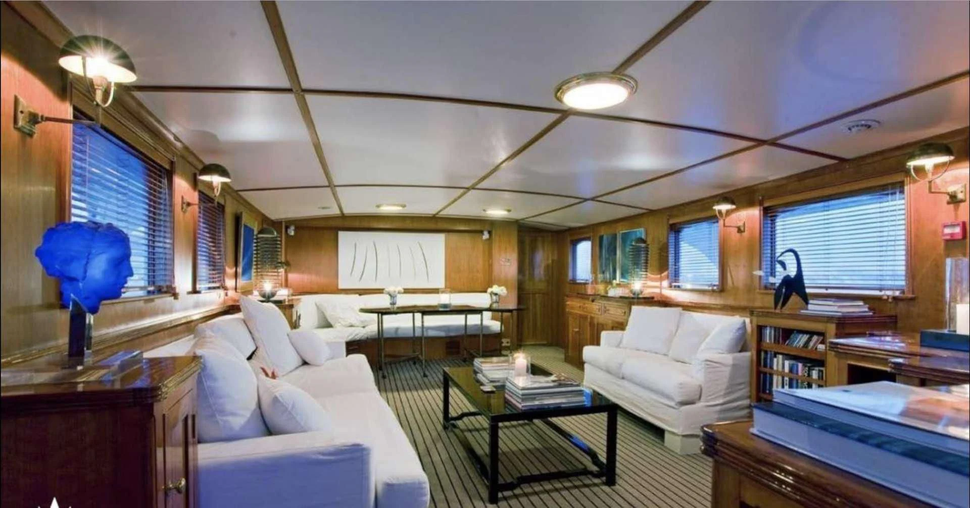 a room with a couch and a table aboard CAMARA C Yacht for Sale