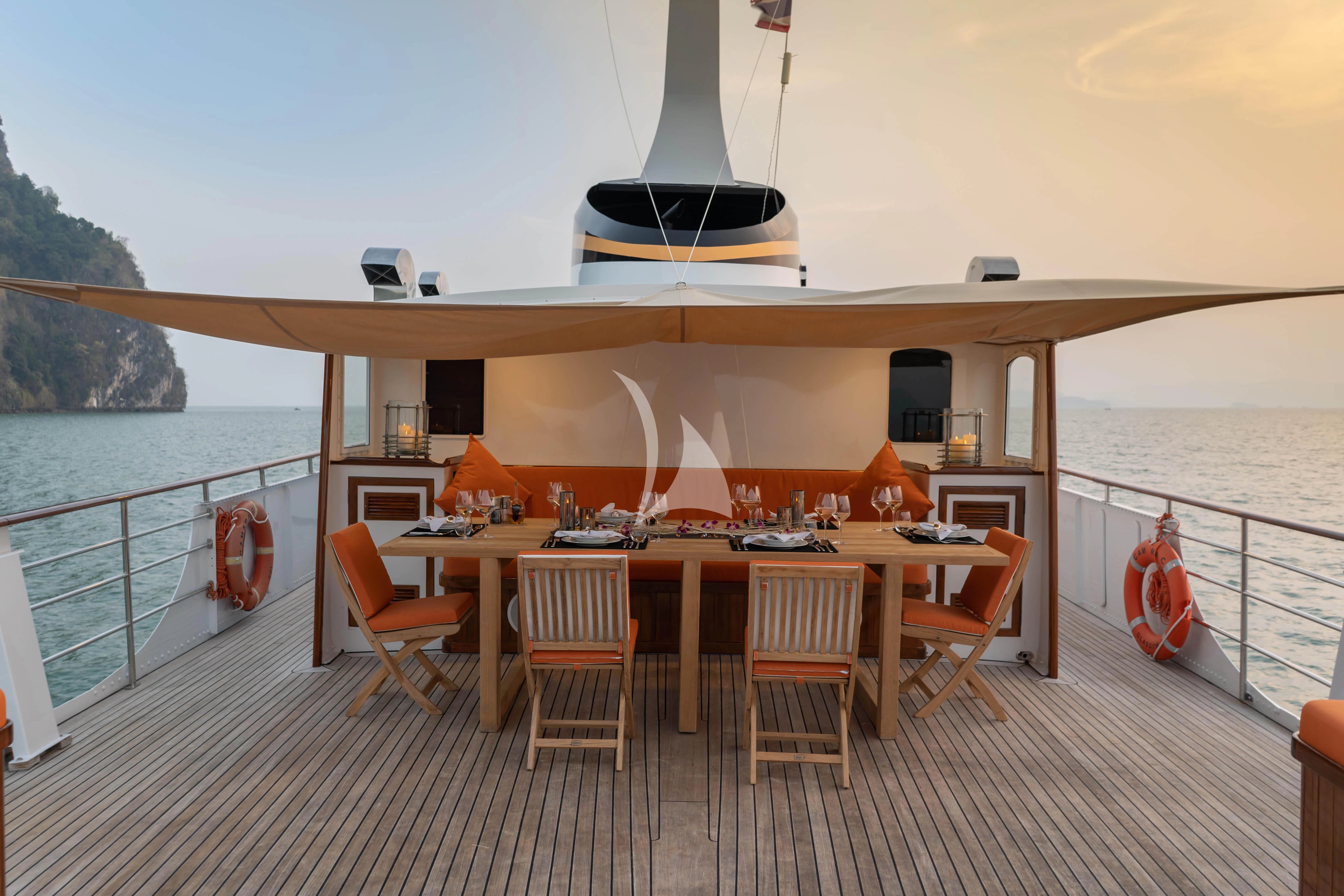 a table on a deck aboard CAMARA C Yacht for Sale
