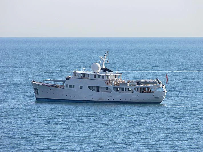 a large white ship in the water aboard CAMARA C Yacht for Sale