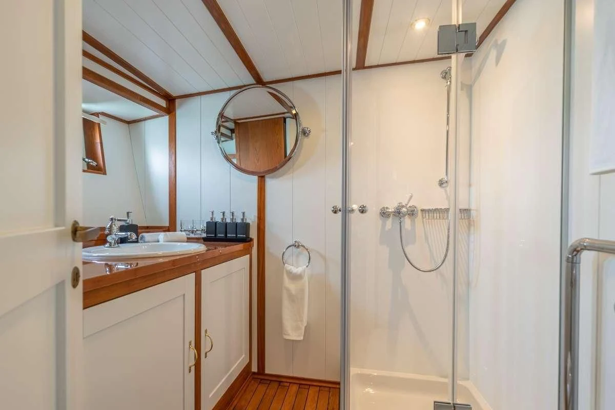 a bathroom with a shower unit aboard CAMARA C Yacht for Sale