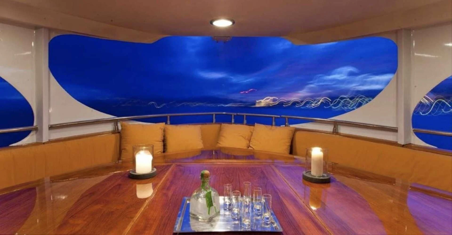 a room with a table and a bed aboard CAMARA C Yacht for Sale