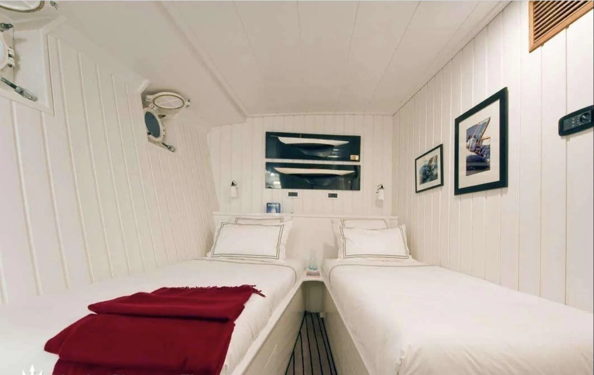 a room with white beds aboard CAMARA C Yacht for Sale