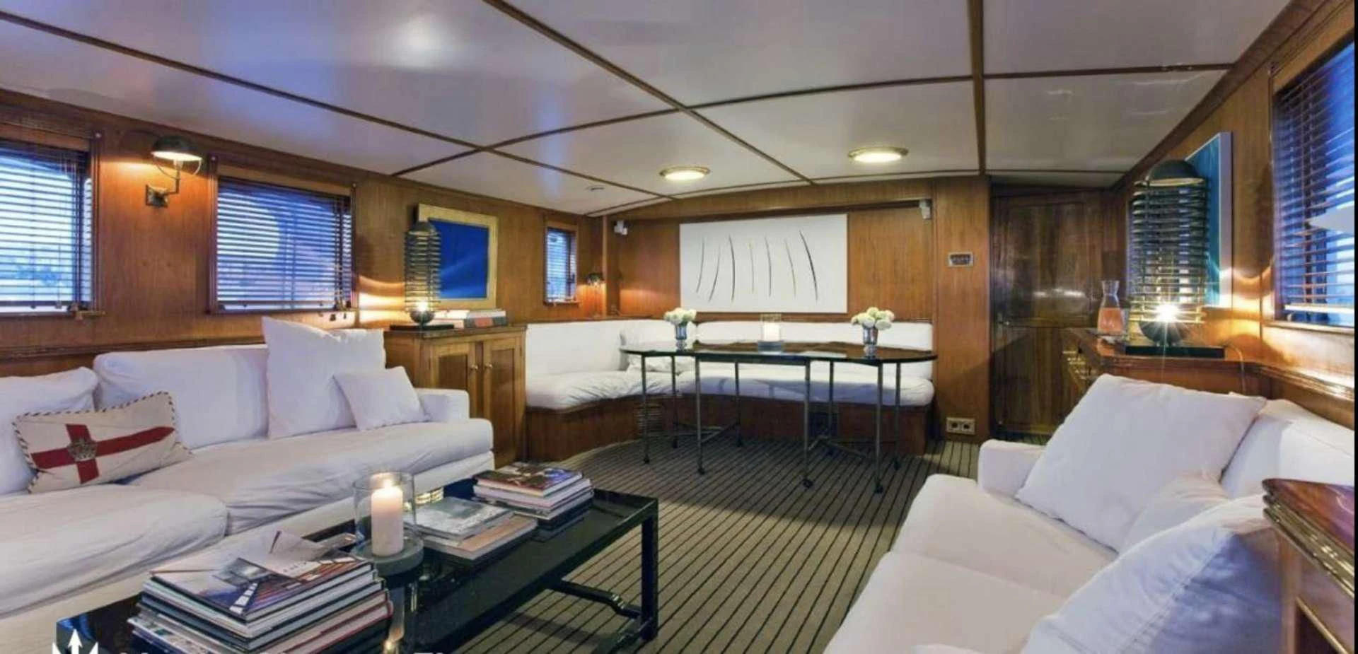 a room with a couch and a table and a television aboard CAMARA C Yacht for Sale