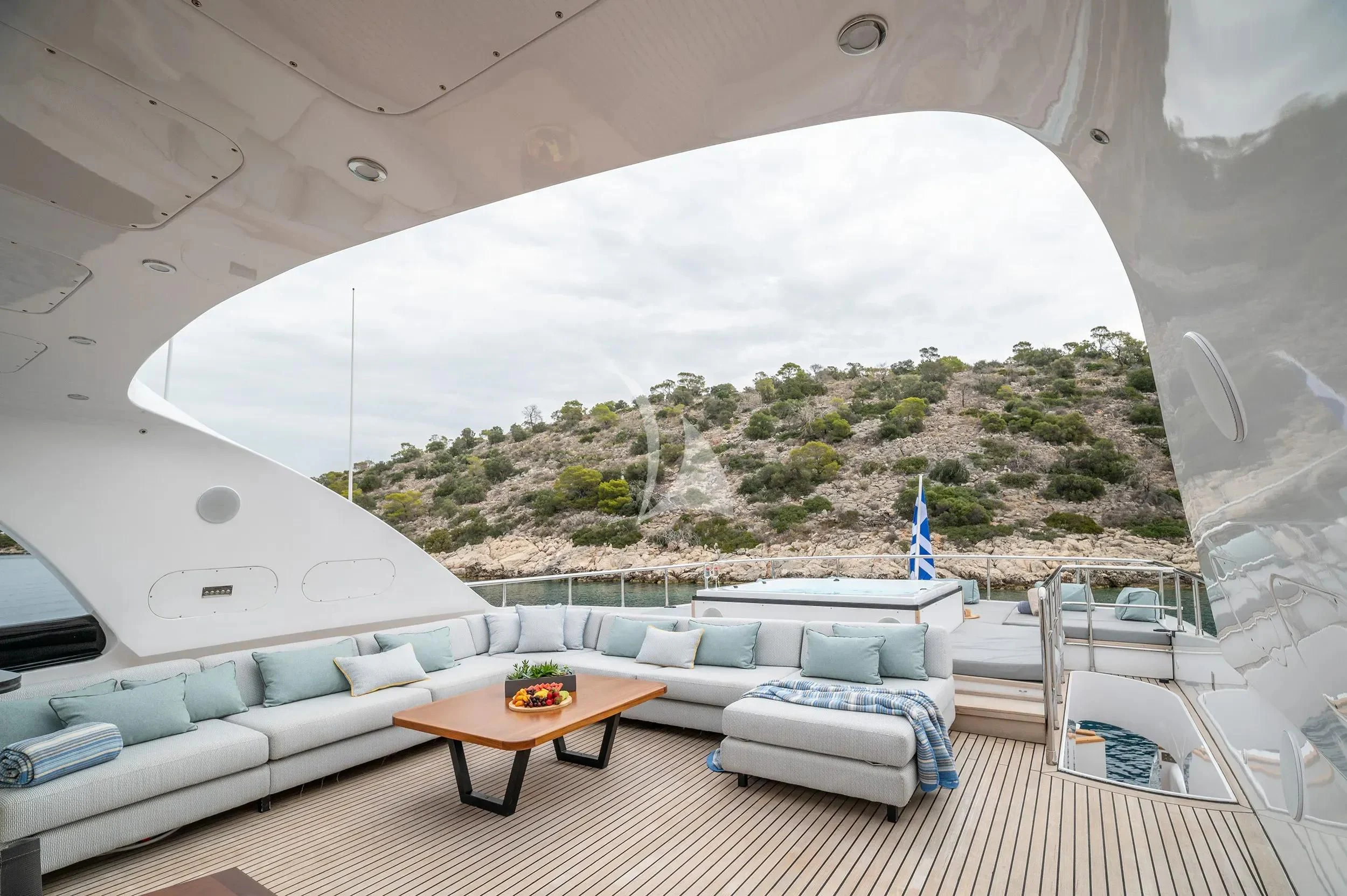 a room with a couch and a table and a large window aboard PAREAKI II Yacht for Sale