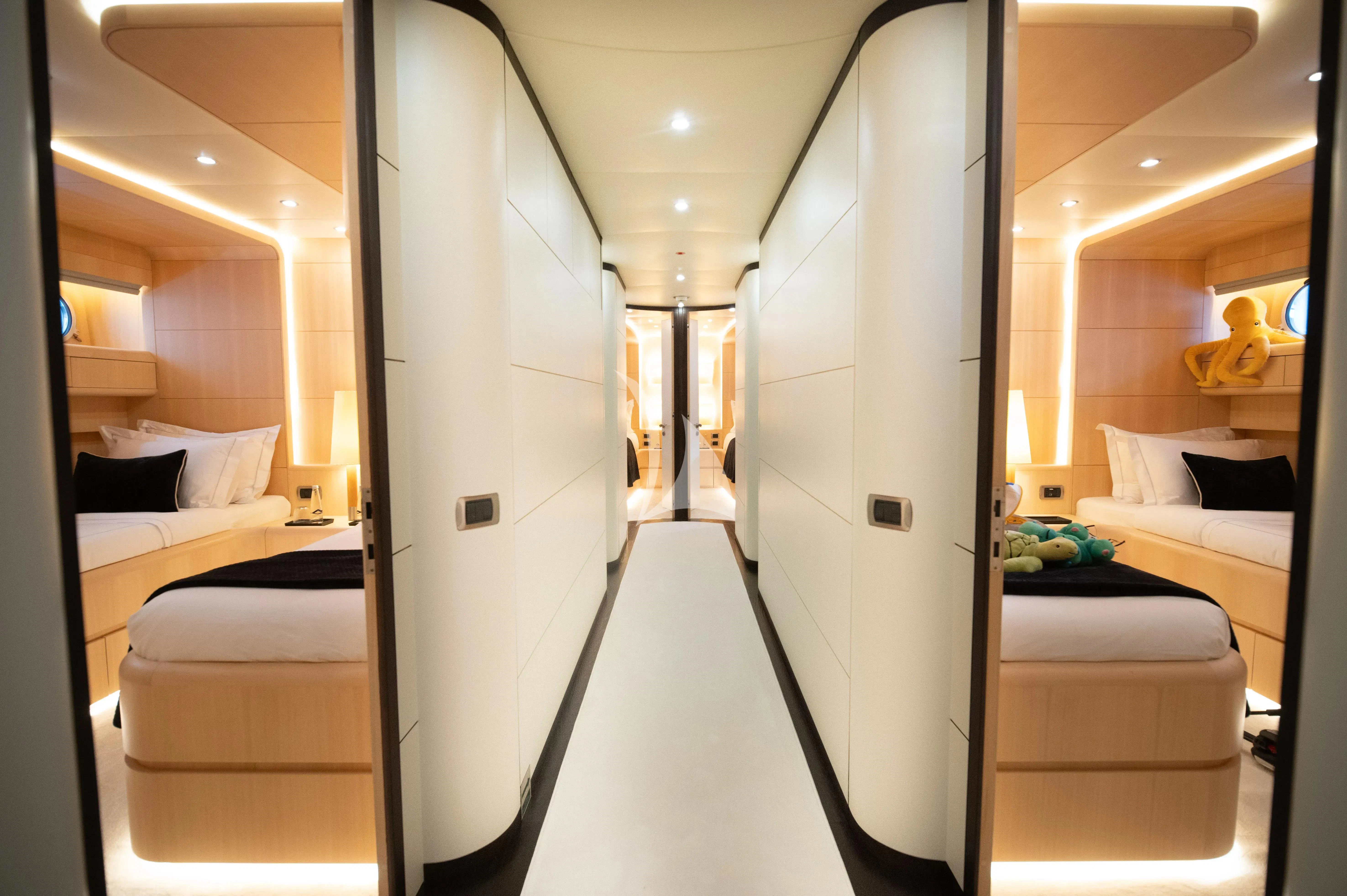 a room with a bed and a mirror aboard PAREAKI II Yacht for Sale