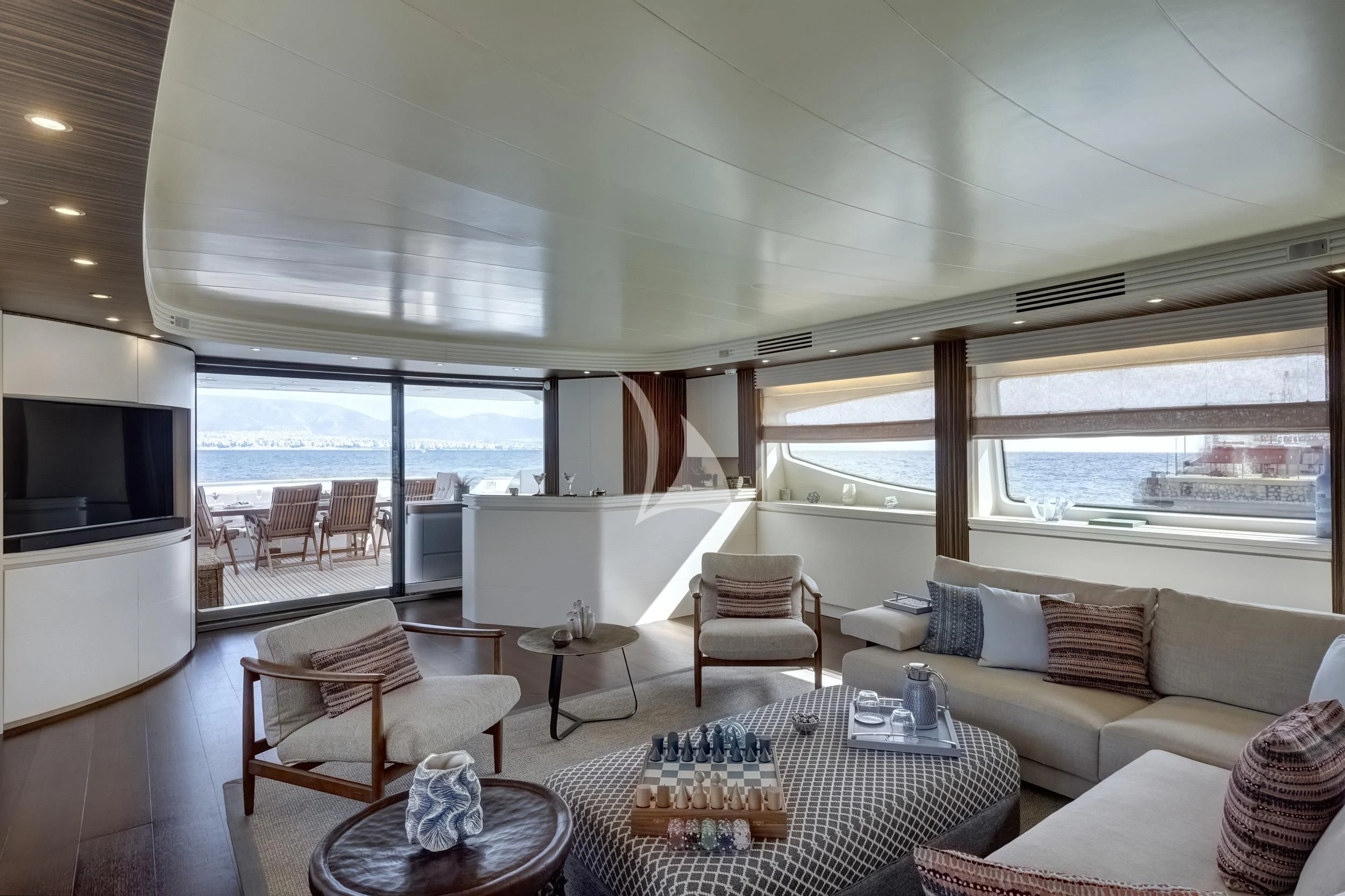 a living room with a large window aboard PAREAKI II Yacht for Sale
