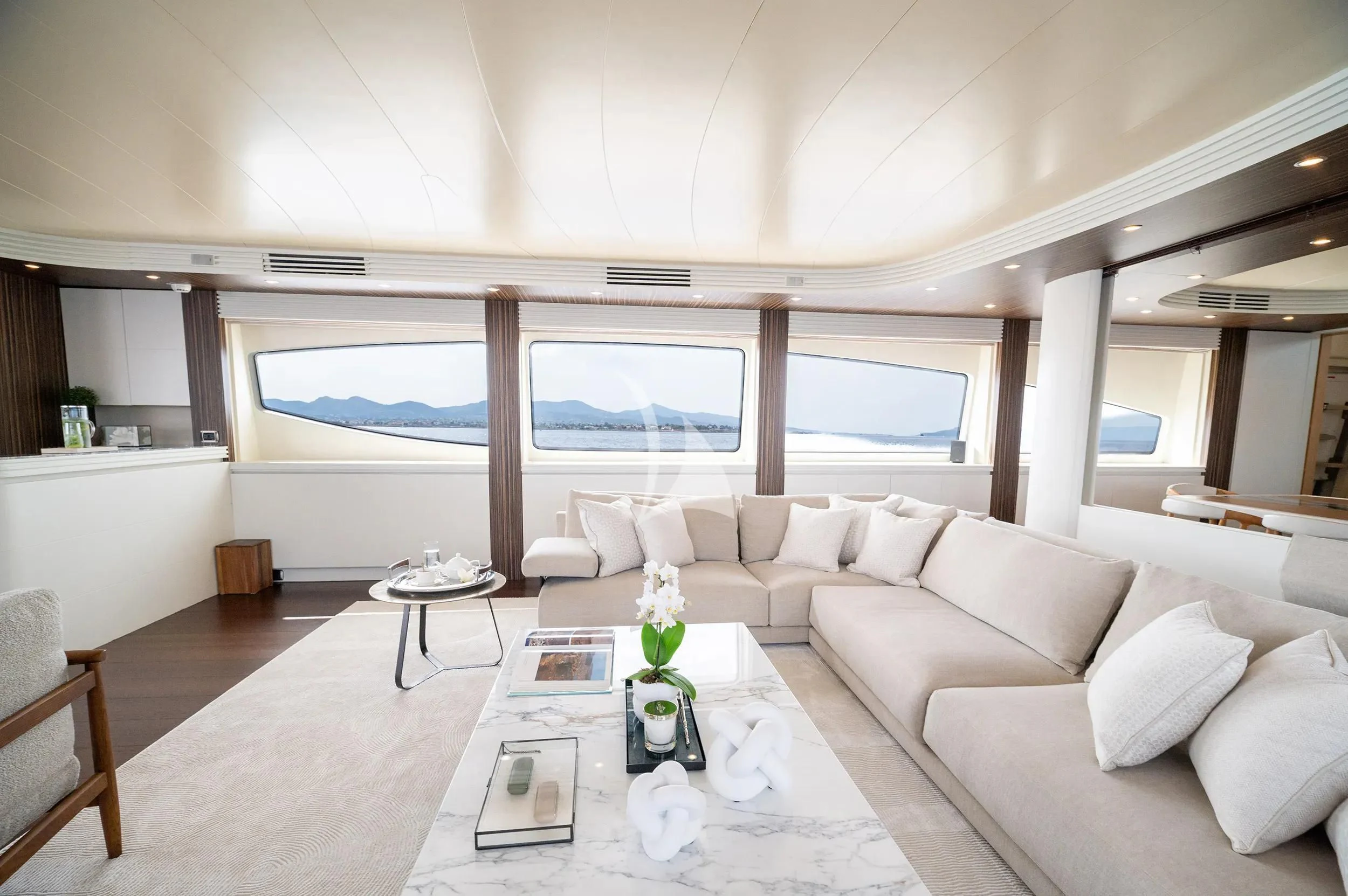 a living room with a large window aboard PAREAKI II Yacht for Sale