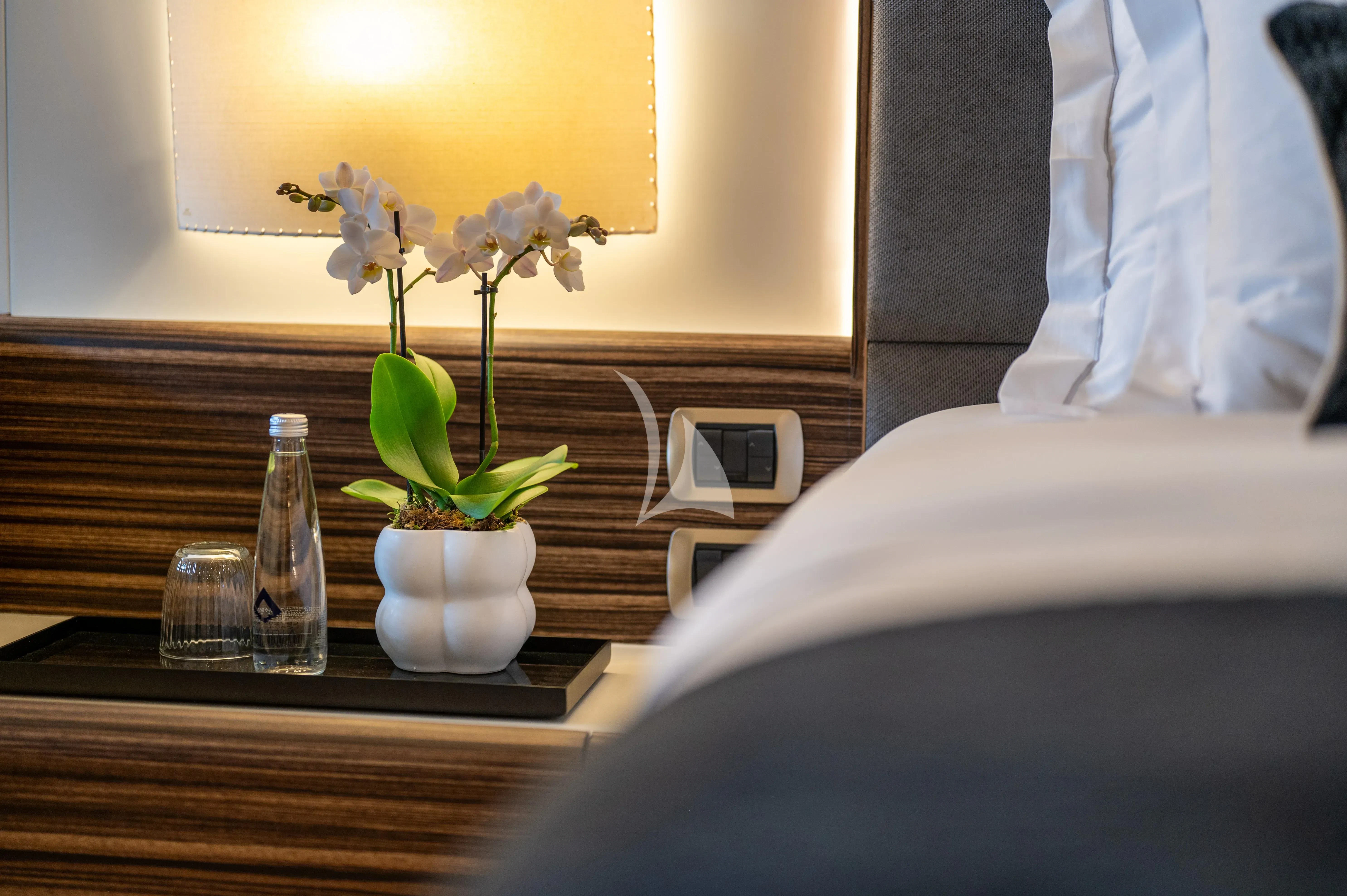 a vase of flowers on a table aboard PAREAKI II Yacht for Sale