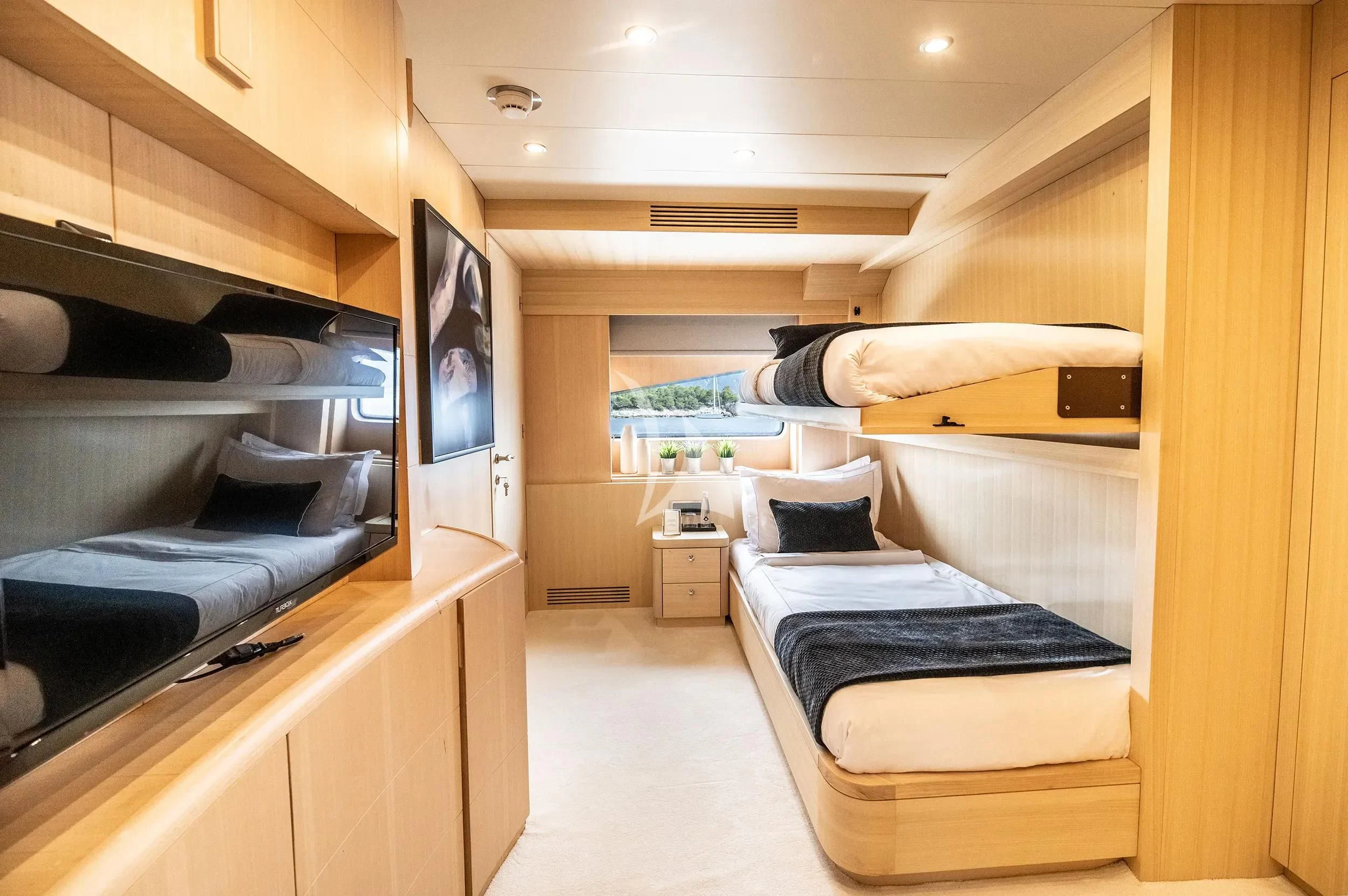 a room with a bed and a tv aboard PAREAKI II Yacht for Sale