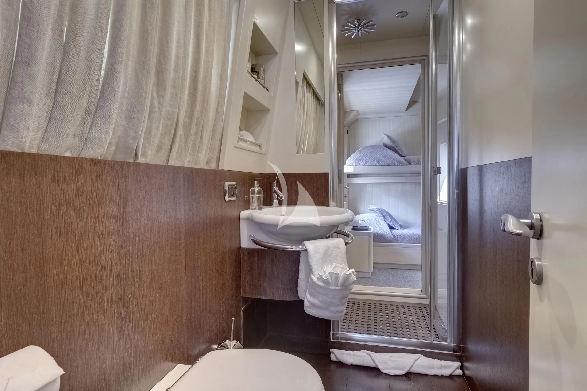 a bathroom with a large mirror aboard PAREAKI II Yacht for Sale