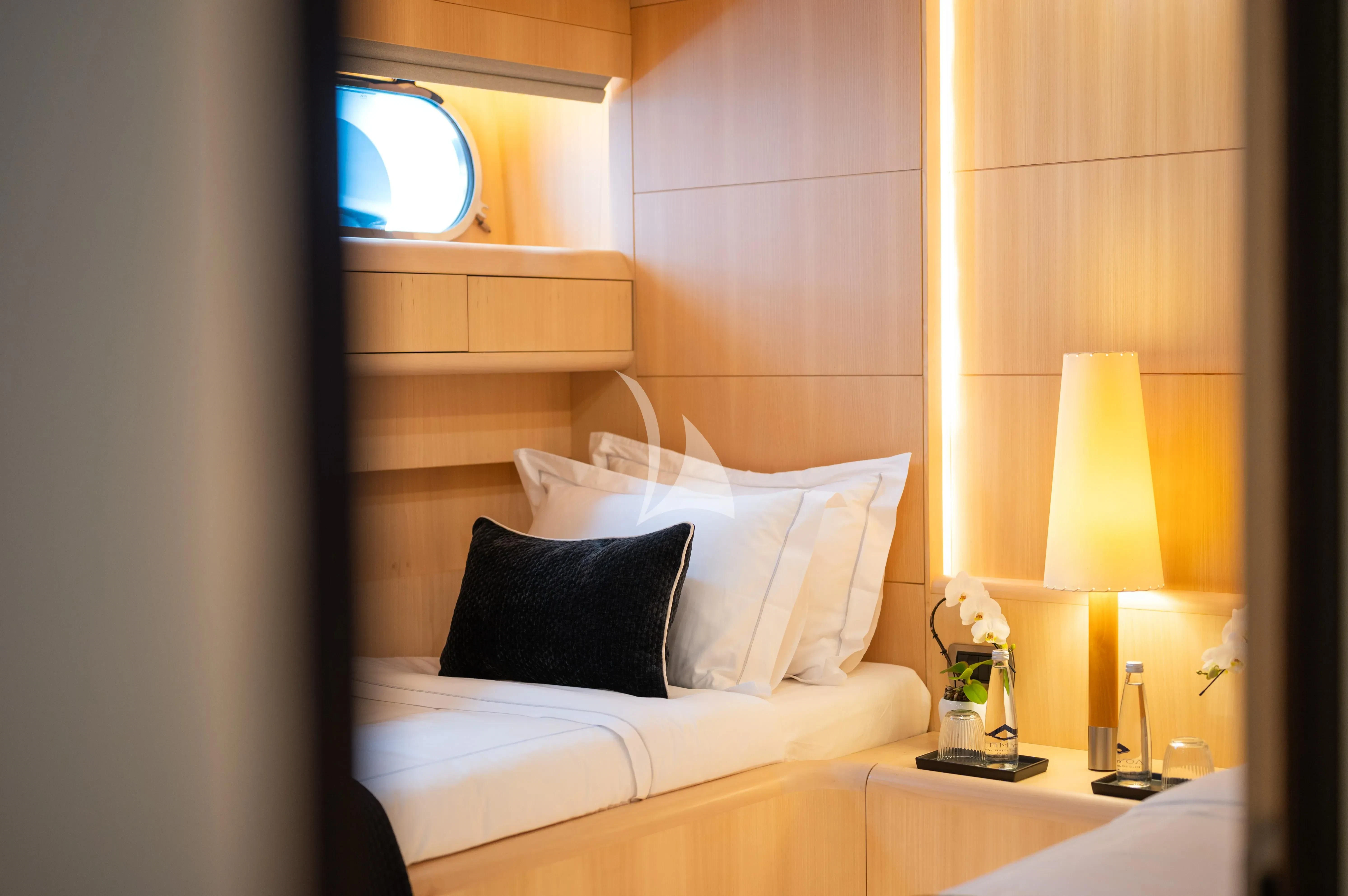 a hotel room with two beds aboard PAREAKI II Yacht for Sale