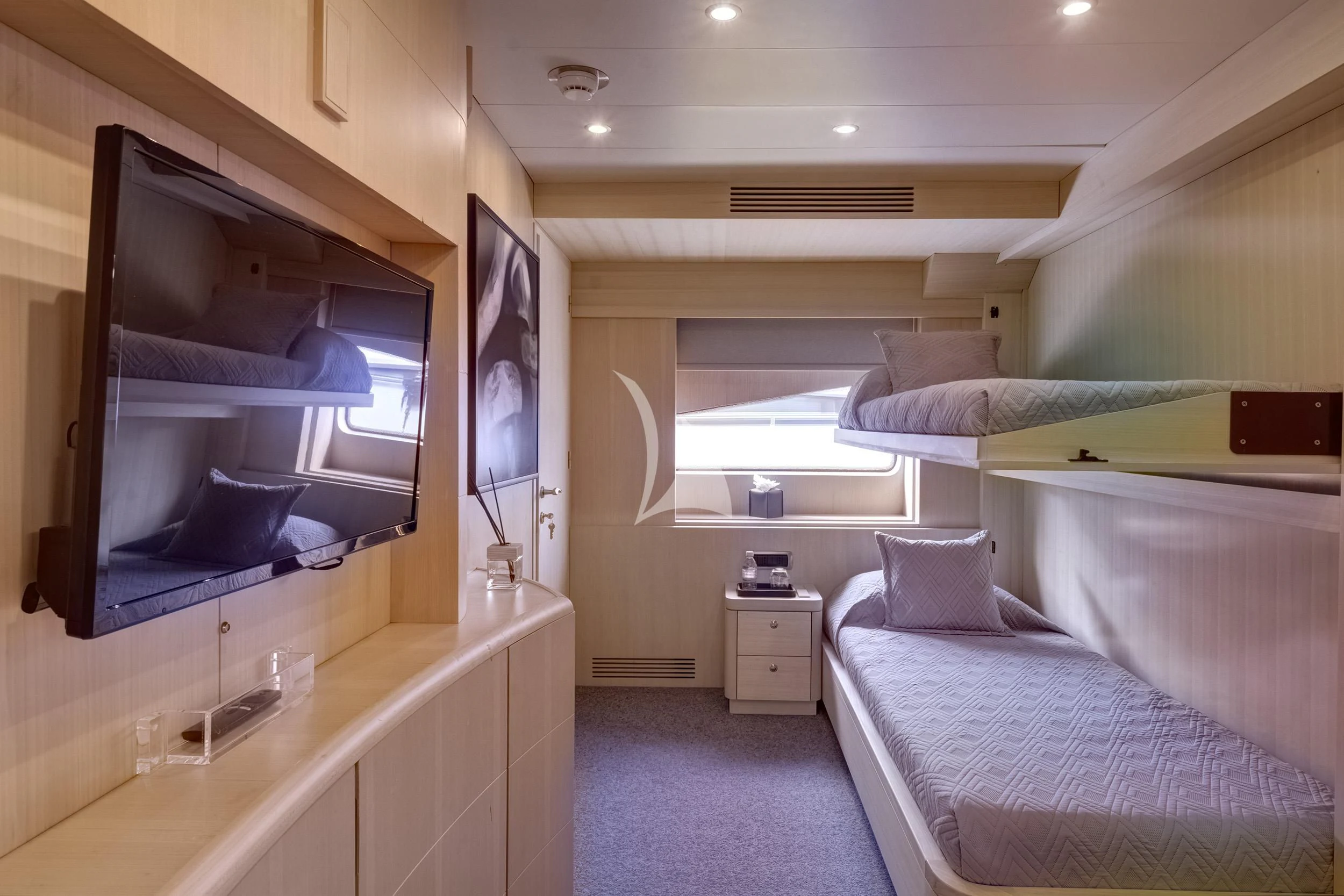 a room with a bed and a television aboard PAREAKI II Yacht for Sale