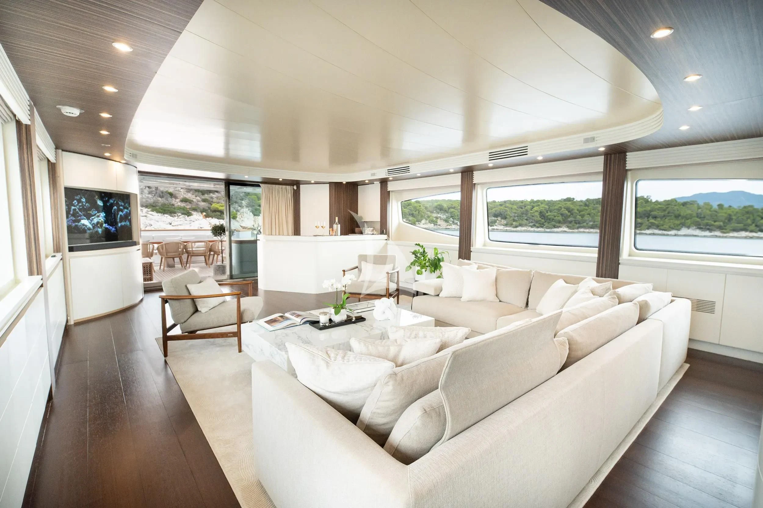 a living room with a large window aboard PAREAKI II Yacht for Sale